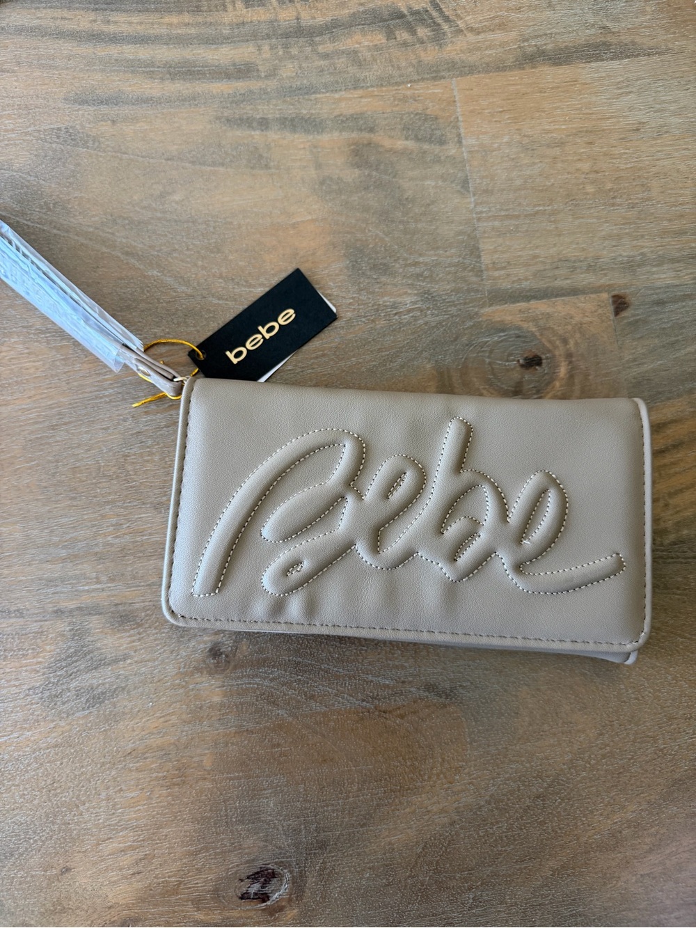 bebe Taupe Embossed Script Wristlet Clutch NWT